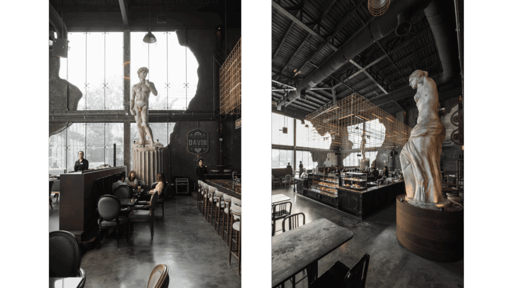 DAVIN CAFE สถานที่เช่าสำหรับถ่ายรูปสไตล์ Cafe Studio โดดเด่นด้วยดีไซน์ industrial หรู พร้อมรูปปั้นคลาสสิกและเพดานสูง เหมาะสำหรับงานถ่ายภาพ แฟชั่น และโปรดักชันระดับมืออาชีพ