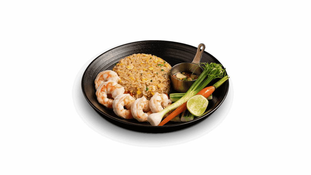 SHRIMP FRIED RICE at DAVIN CAFE restaurant Bangkok featuring wok-fried rice with juicy shrimp, fresh vegetables, lime and chili fish sauce, a classic Thai seafood dish loved in Bangkok restaurant scene