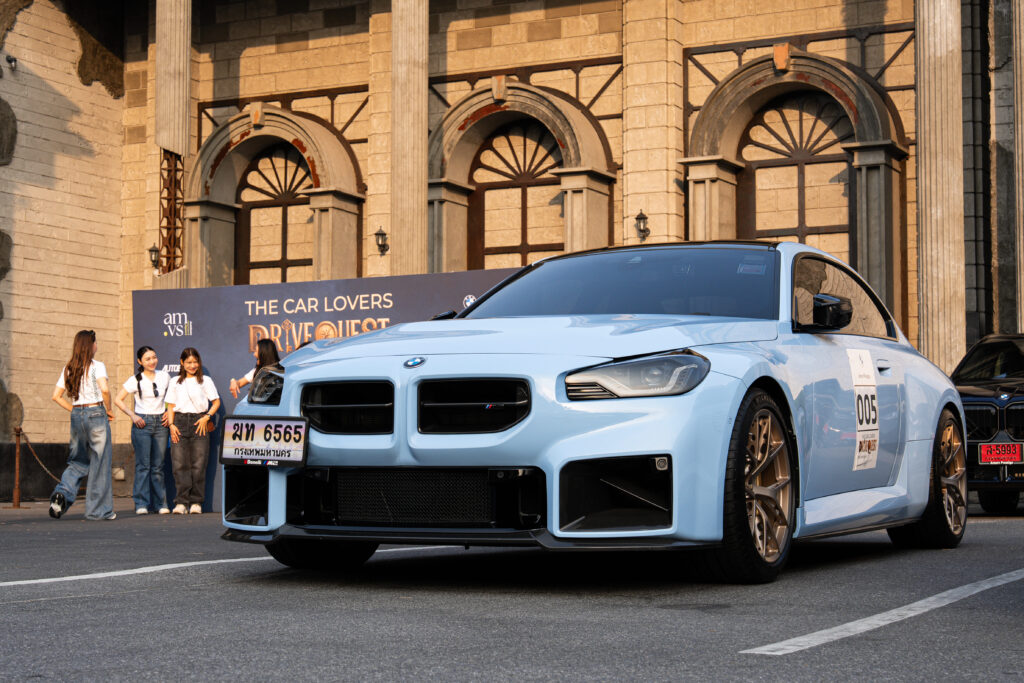 The Car Lovers Drive Quest 2026 at DAVIN CAFE, premium event venue featuring luxury BMW performance car display in front of the venue, modern lifestyle event space ideal for automotive events and gatherings