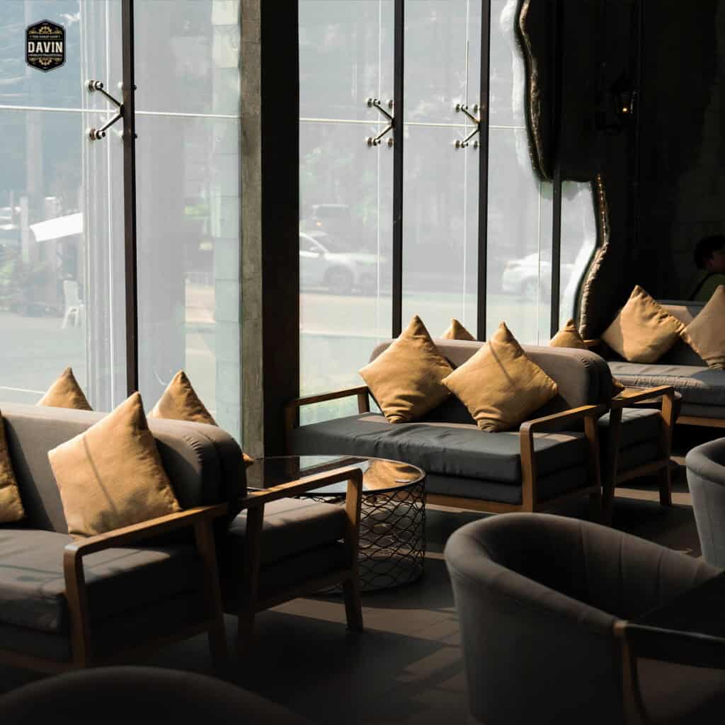 Comfortable lounge seating by the window at Davin Cafe, a Bangkok cafe with natural light, refined interiors, and relaxed seating areas designed for coffee breaks, casual meetings, and premium private dining or event gatherings.