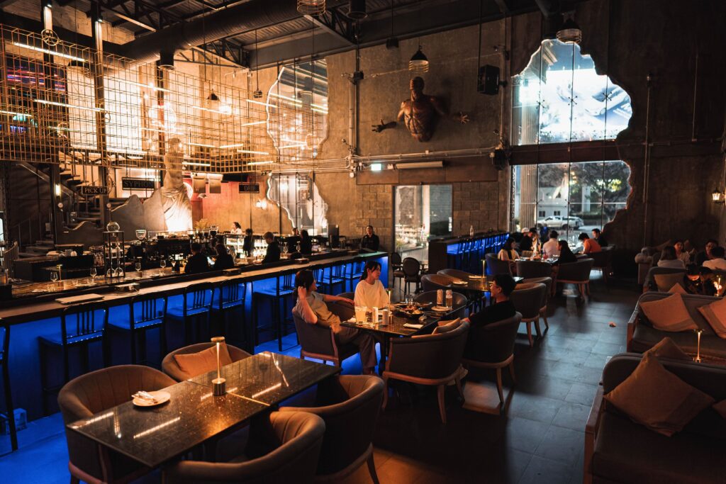 Nighttime atmosphere inside DAVIN CAFE, a good atmosphere restaurant featuring luxury interior design, cozy dining zones, stylish cafe seating, and premium nightlife experiences for special occasions and elegant gatherings