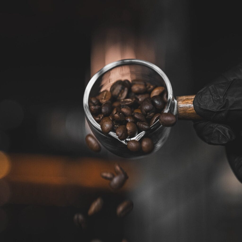 Specially selected roasted coffee beans for cold brew at DAVIN CAFE, showcasing the premium bean selection process that creates smooth sweetness, complex aroma, balanced flavor, and a distinctive specialty coffee experience