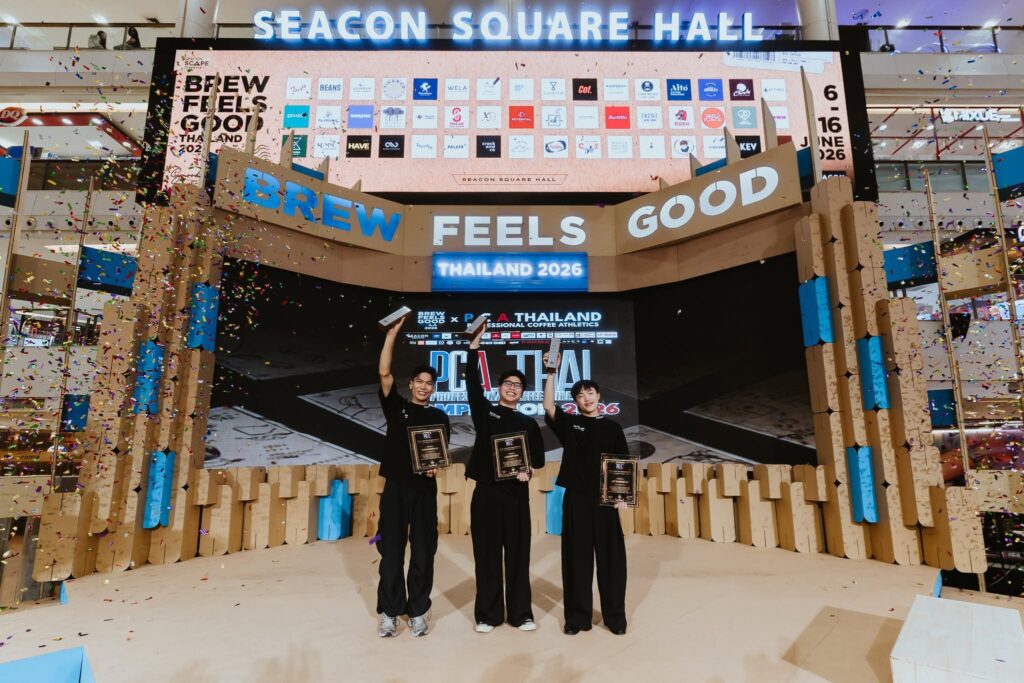 Champions of PCA Latte Art Thailand 2026 celebrating on the Brew Feels Good Thailand stage, representing national barista excellence, specialty coffee innovation, and latte art mastery, with DAVIN CAFE proudly contributing to Thailand’s competitive coffee industry