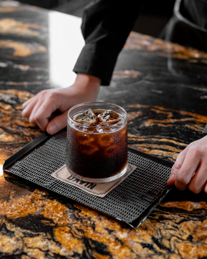 Signature Cold Brew coffee at DAVIN CAFE served over ice, showcasing a smooth flavor profile, natural sweetness, and rich coffee aroma crafted through a specialty cold brew extraction process for a premium coffee experience