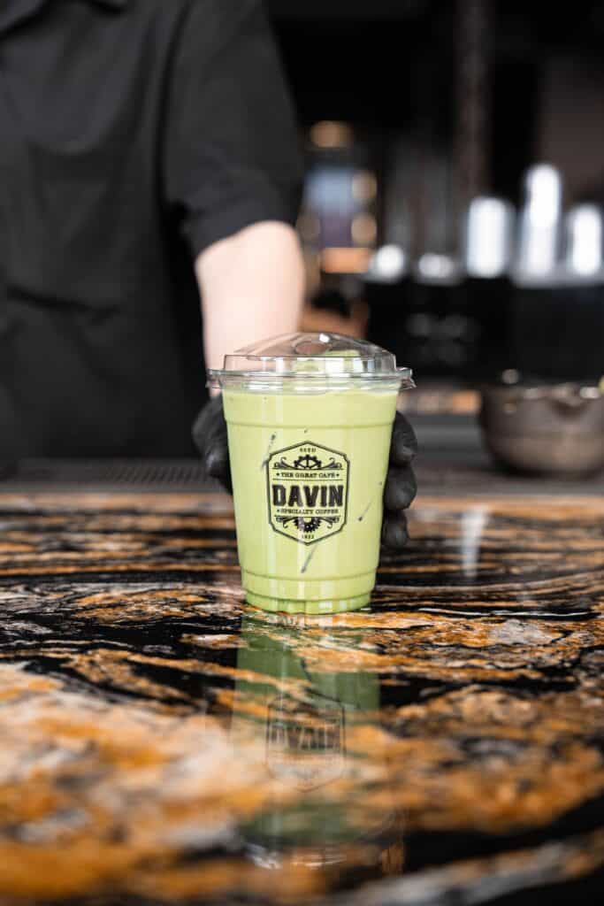 Premium Matcha Latte freshly served at DAVIN CAFE Bangkok, crafted with authentic Japanese matcha for a rich, smooth, creamy texture and vibrant green tea flavor in every sip.