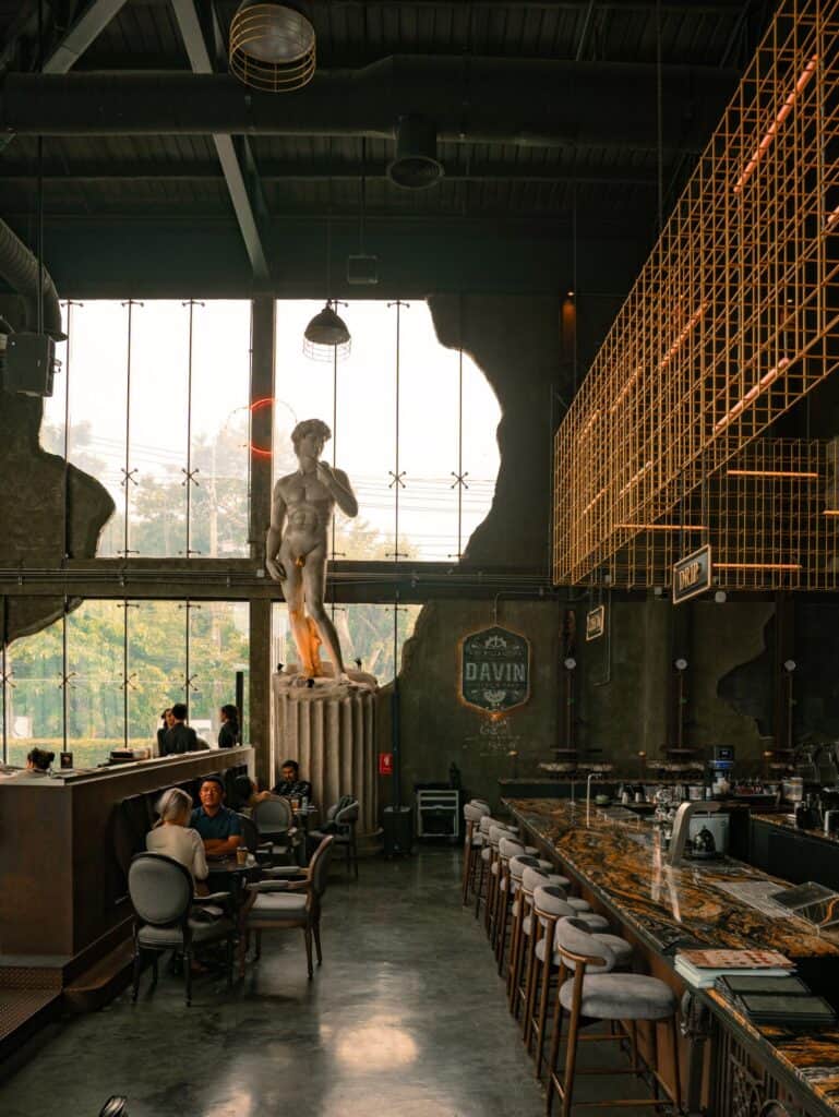 Cafe photo poses location at DAVIN CAFE Bangkok featuring an Industrial Loft interior with Roman-inspired architecture
