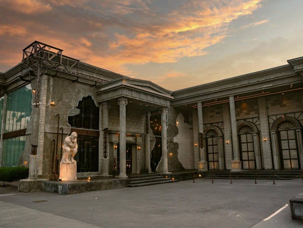 European style cafe Bangkok at DAVIN CAFE featuring Greek-Roman architecture, classical columns and statues at sunset