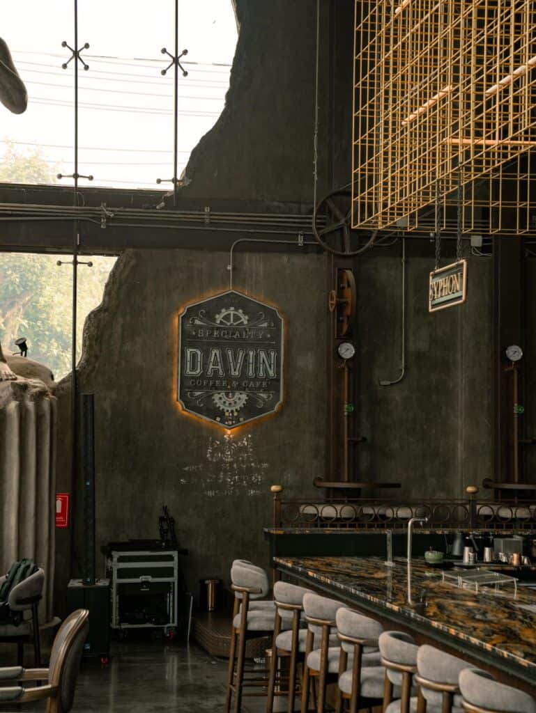 Reading cafe interior at DAVIN CAFE near Liab Duan Bangkok with counter seating, industrial design, and natural light
